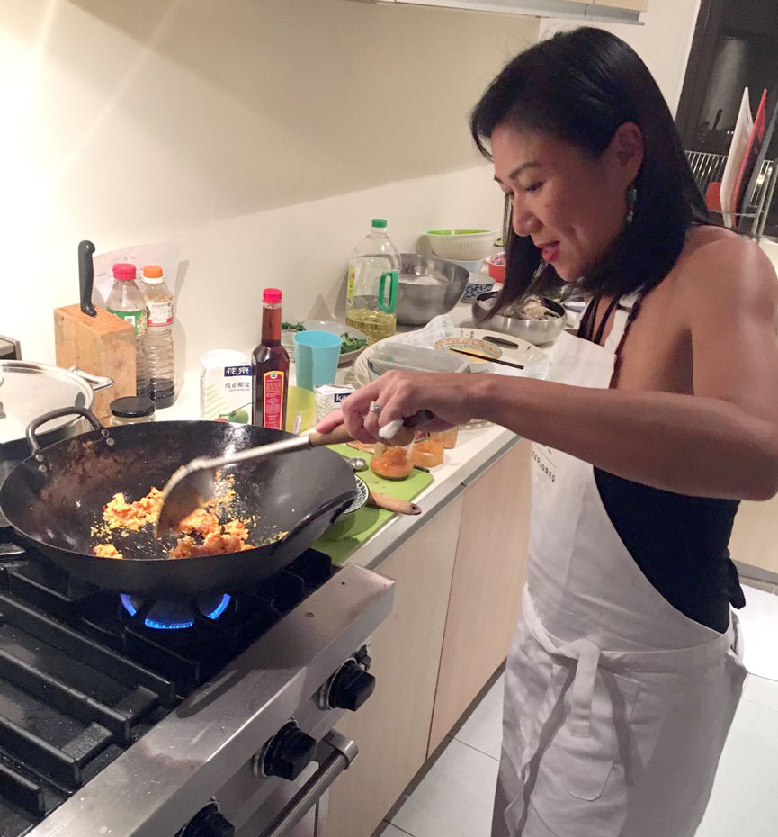 In the kitchen with Kell who expertly stir fries the Crab with Curry Powder.