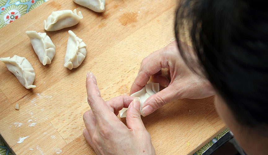 Do the same pleating pattern on the other side of the dumpling.