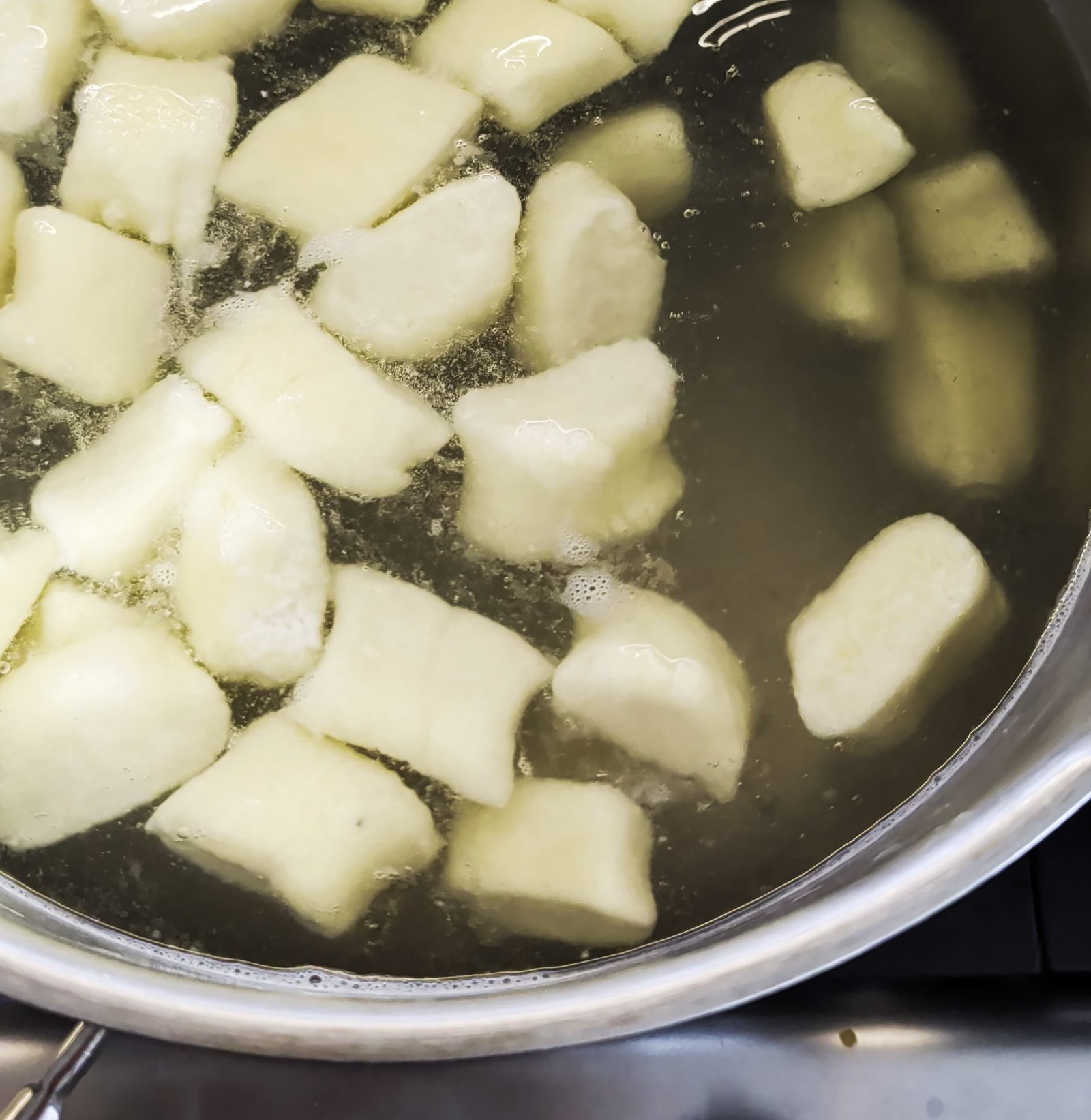 Boiling homemade ricotta gnocchi until they float
