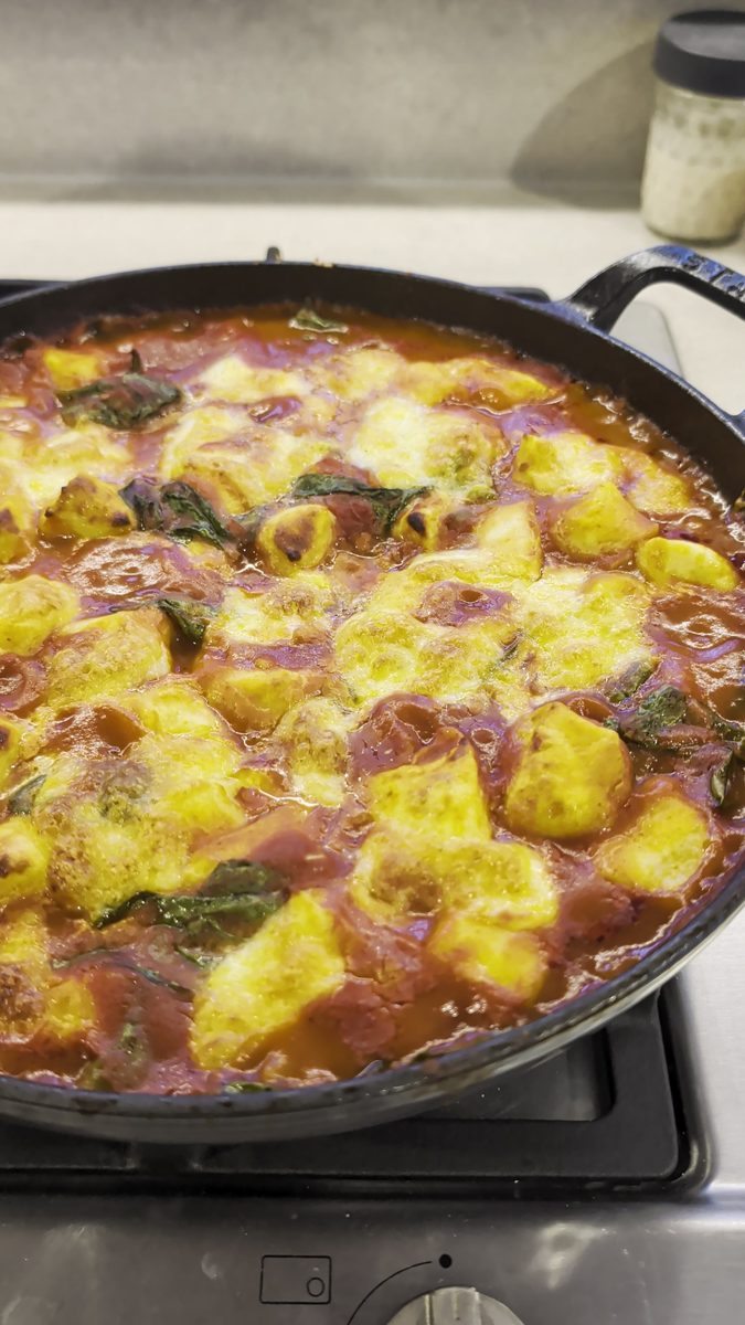 Golden, bubbly baked ricotta gnocchi fresh from the oven